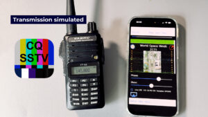 Smartphone running the CQ SSTV app decodes an ISS image while a Yaesu FT-65 handheld is tuned to 145.800 MHz; receive-only demo.
