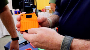 Orange Heltec T114 Meshtastic node with display and external LoRa antenna